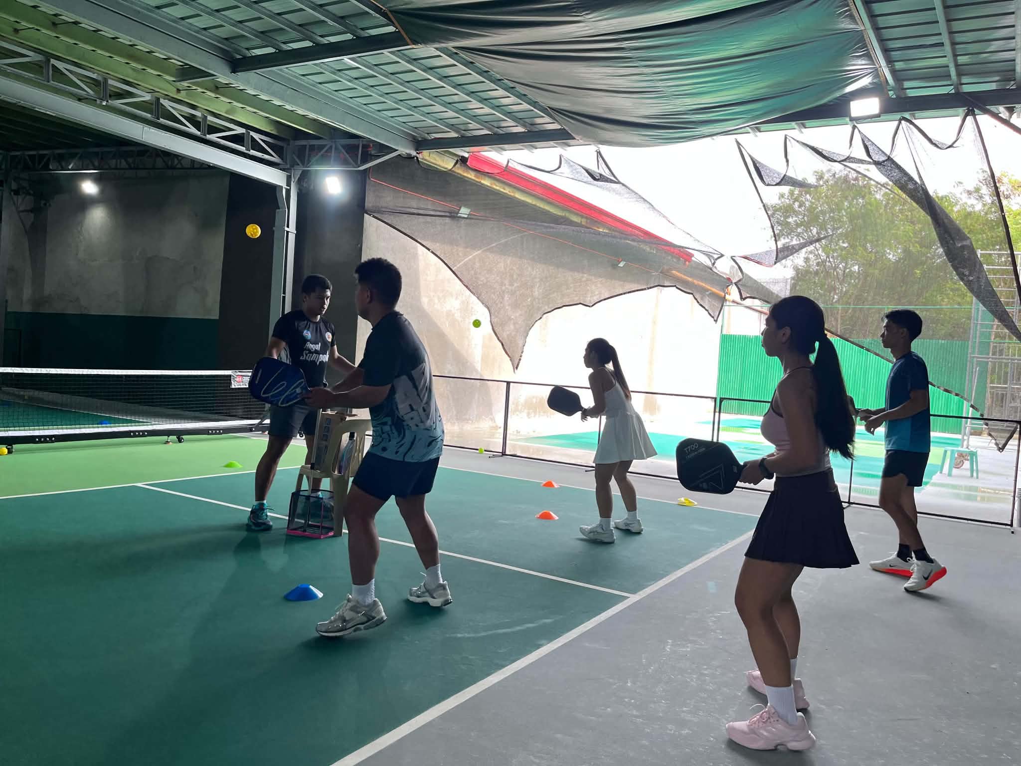 A coaching session on a Round X court